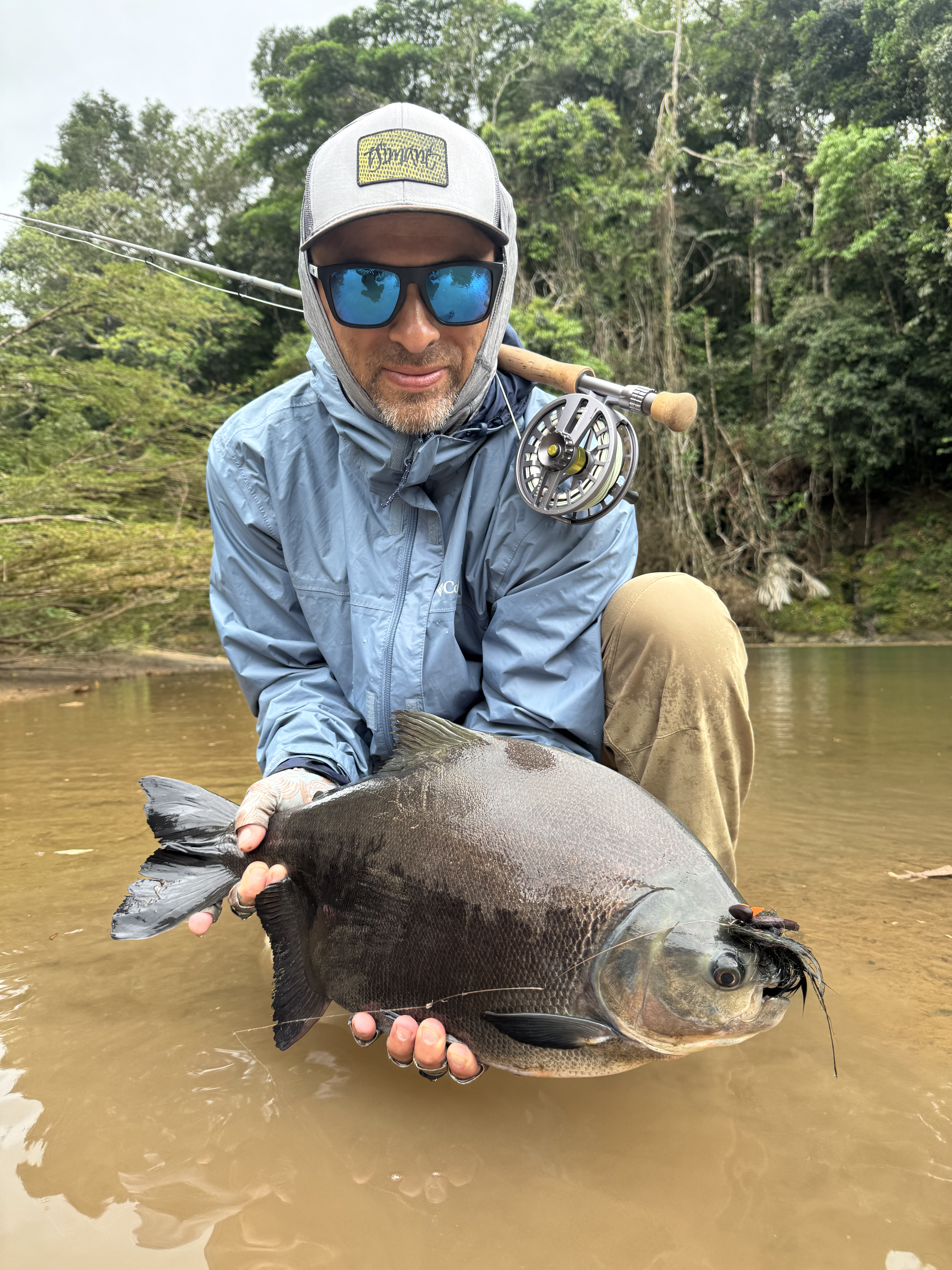 Randy with the pacú he fooled on a dry fly before the storm