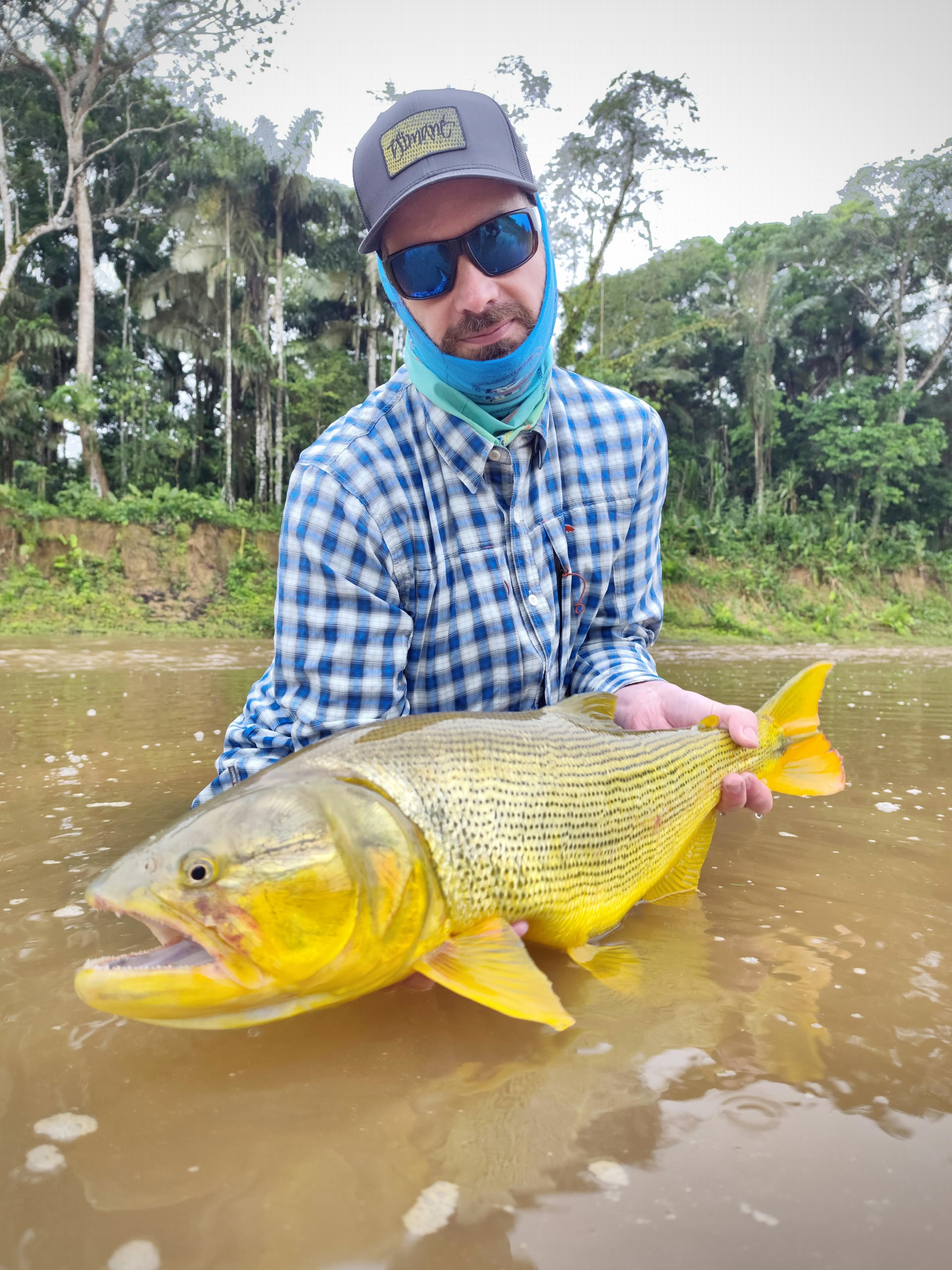 Christian with the dorado of about 8 kilograms (18 pounds) that took a floating fly